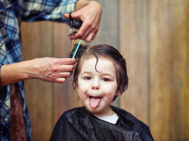 giving young autistic child haircut