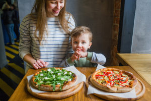 Mom and autistic son make homemade pizza